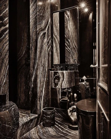 Luxurious bathroom interior featuring a sink, mirror, and various decor elements, all adorned with a distinctive wood-grain marble pattern.