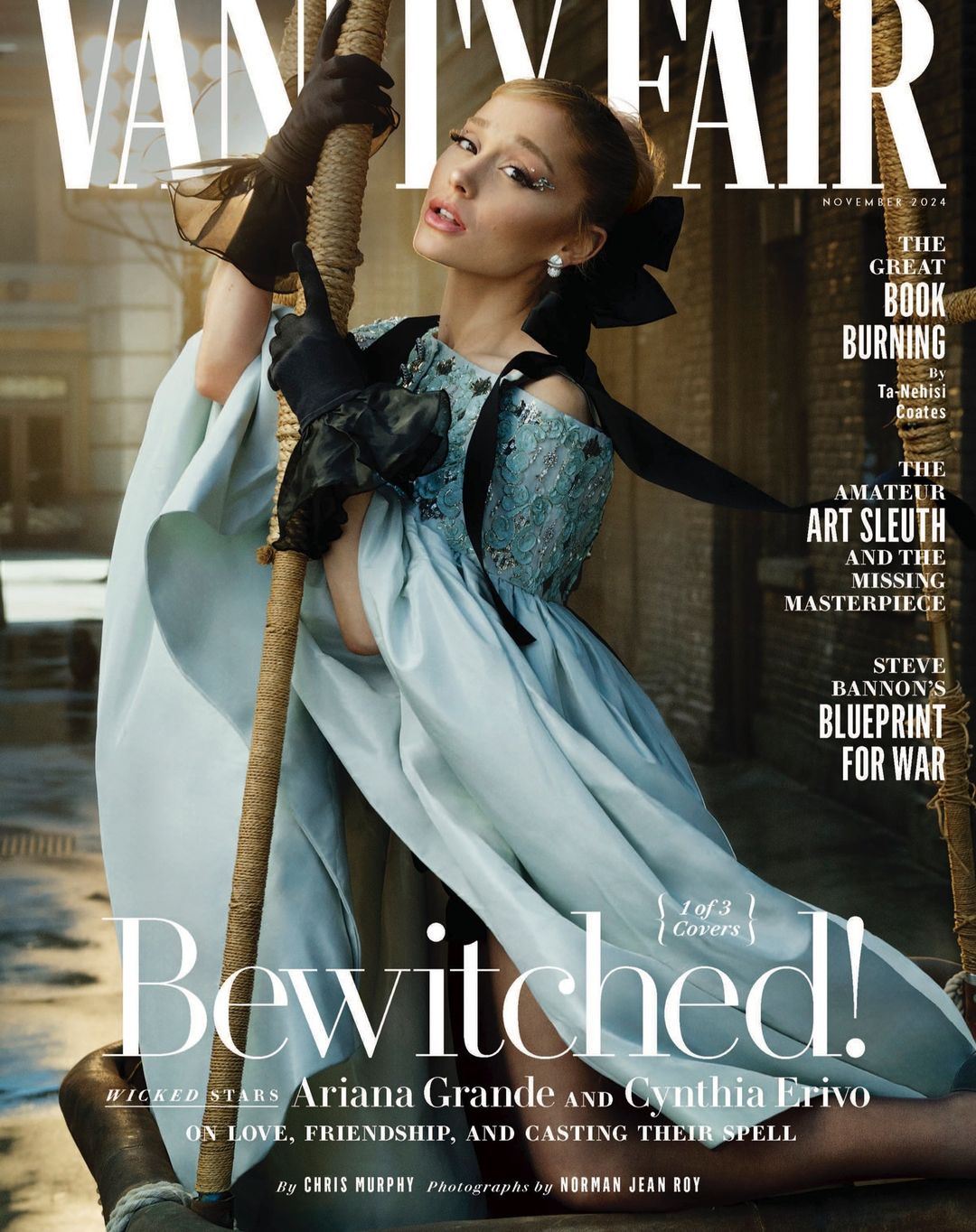 Vanity Fair magazine cover featuring Ariana Grande in a pale blue dress with black gloves, posing against a textured background.