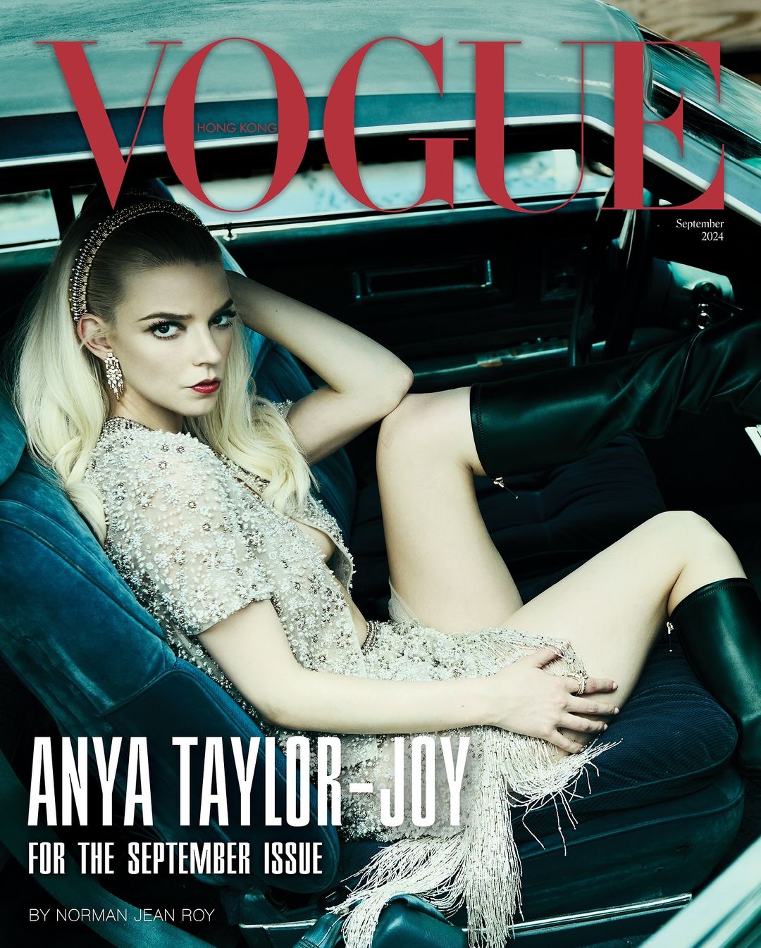 Anya Taylor-Joy on Vogue Hong Kong cover, seated inside a car. She wears a beaded dress with fringe, headband, and knee-high boots.