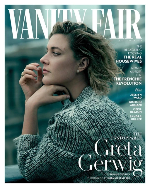 Magazine cover featuring a profile portrait of Greta Gerwig with tousled hair, wearing a grey knit sweater, with 'Vanity Fair' masthead.
