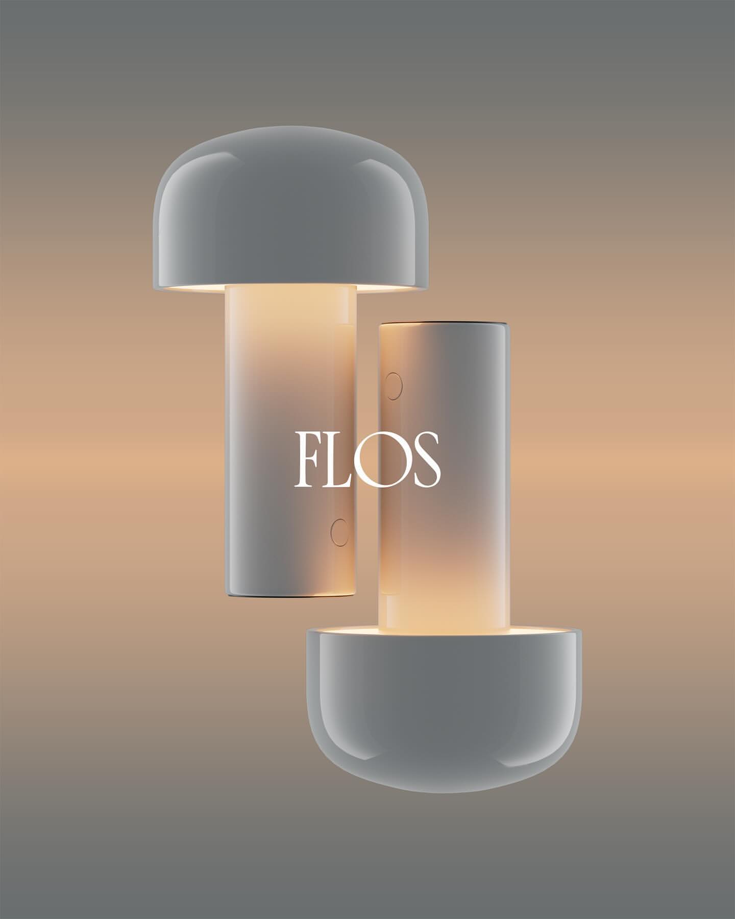 Modern white table lamp with a mushroom-shaped shade and cylindrical base, illuminated against a neutral gradient backdrop.