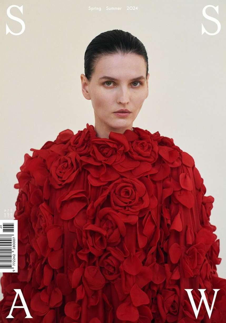 Fashion magazine cover featuring a woman in a red rose dress against a neutral backdrop. Spring/Summer 2024 issue with prominent typography.