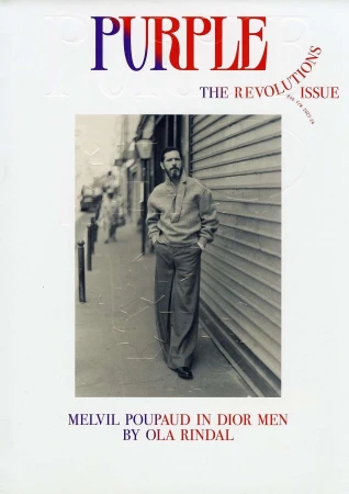 Melvil Poupaud wearing Dior Men standing on a Paris street in a portrait by photographer Ola Rindal for Purple magazine.