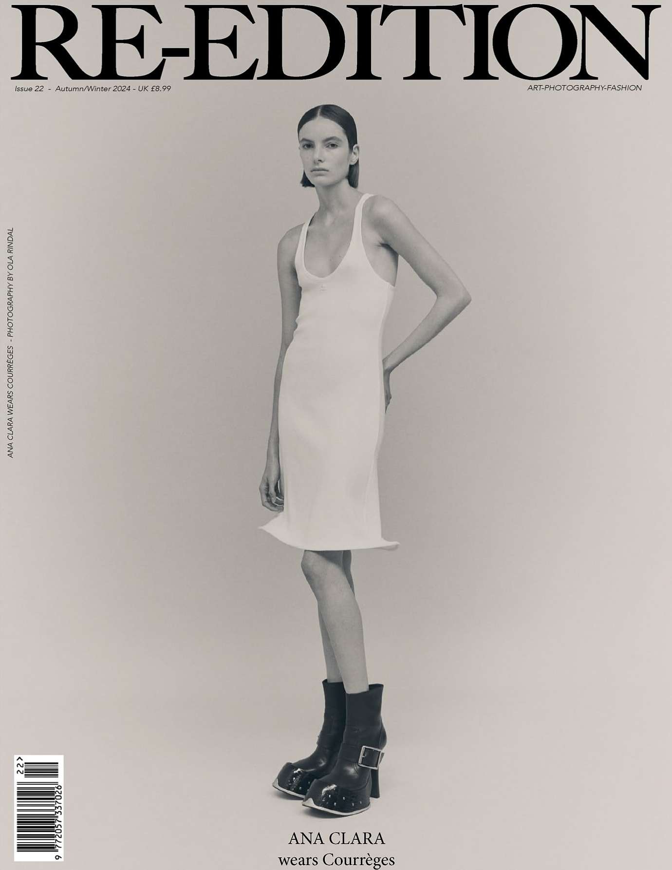 Magazine cover featuring a model in a white dress and black boots against a neutral backdrop, promoting fashion and editorial style.