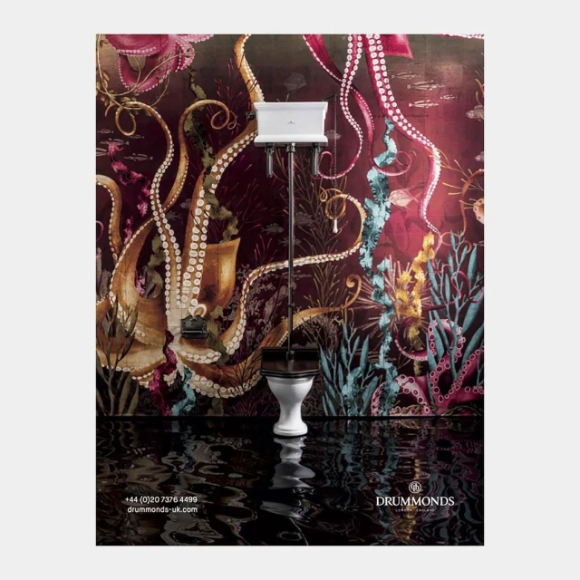 Elegant white ceramic toilet with high tank showcased against a dramatic octopus-themed wallpaper in an interior design context.