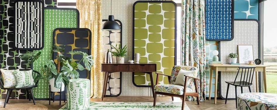 Retro interior design featuring patterned screens, a wooden console table with plants, and chairs with floral upholstery. Interior design.