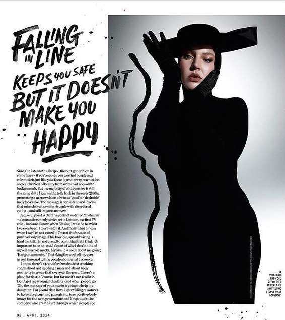 Fashion editorial portrait of a woman in an all-black, long-sleeved dress, gloves, and hat, against a grey backdrop with text.
