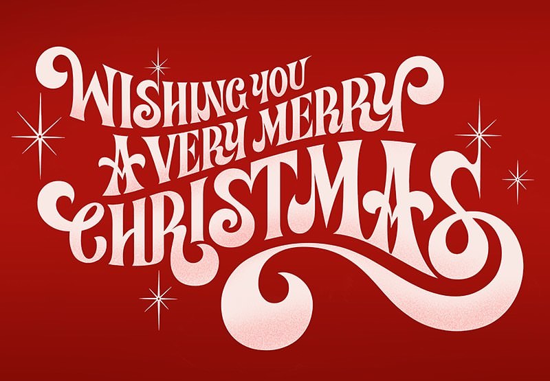 Festive holiday typography art features 'Wishing you a very Merry Christmas' in stylized lettering on a solid red background.