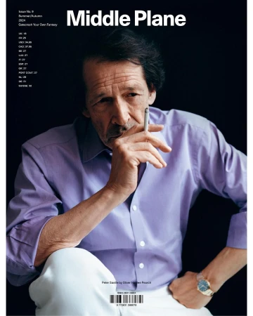 Portrait of Peter Saville smoking a cigarette wearing a lilac shirt and white trousers by photographer Oliver Hadlee Pearch.