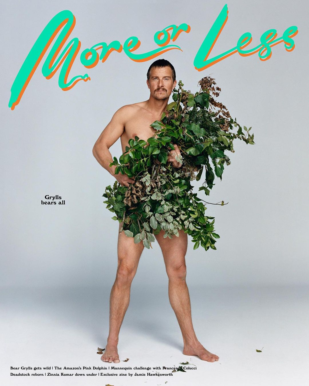 Nude man poses in photo studio with plants covering his body. The magazine cover features vibrant green, orange, and white typography.