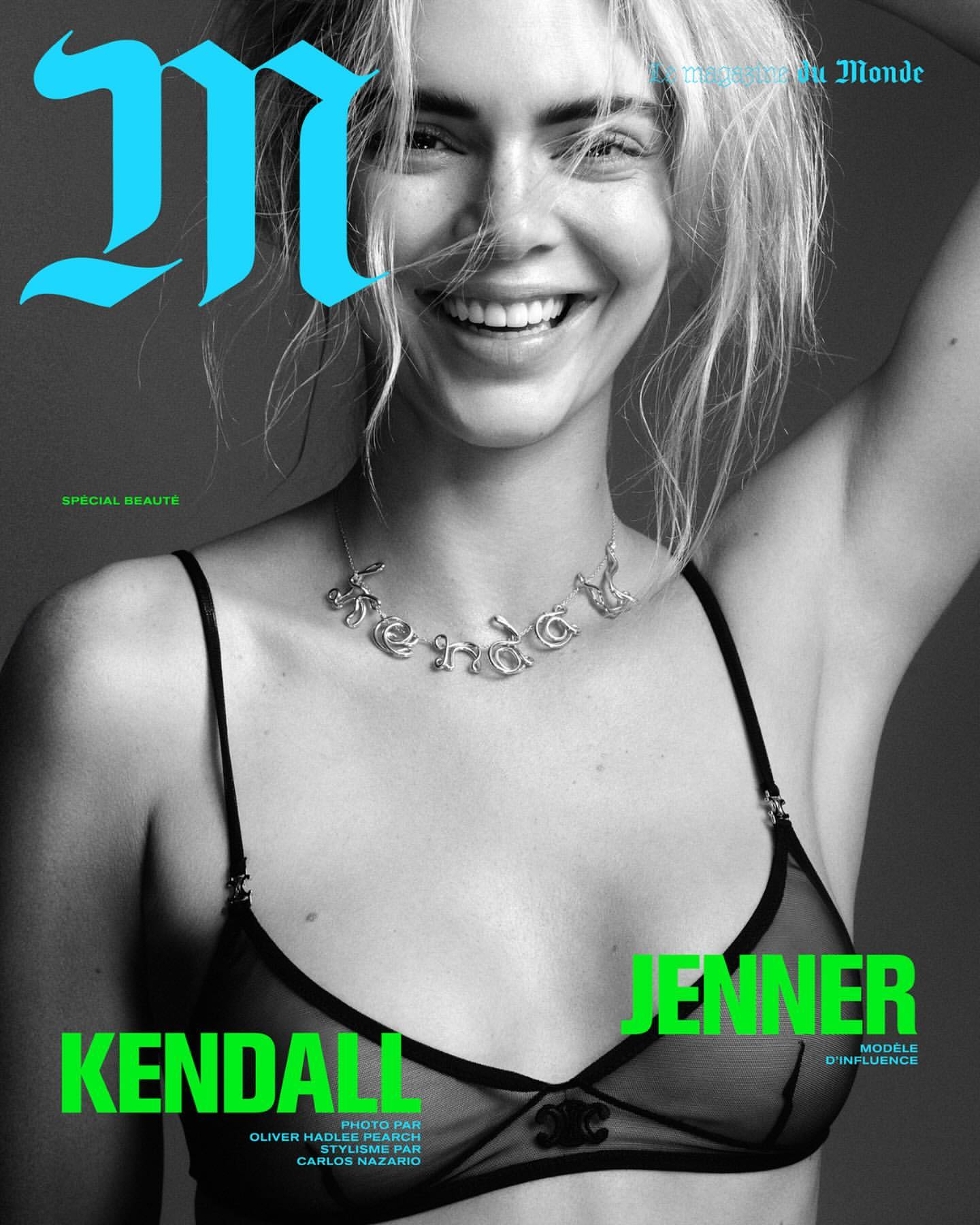 Kendall Jenner smiling in a black bra with a silver necklace, photographed in black and white by Oliver Hadlee Pearch.