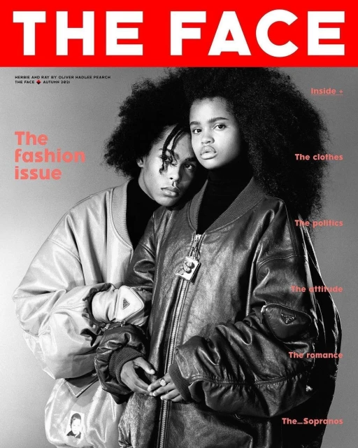 Black and white fashion magazine cover featuring two models wearing bomber jackets and black turtlenecks, with red masthead. 