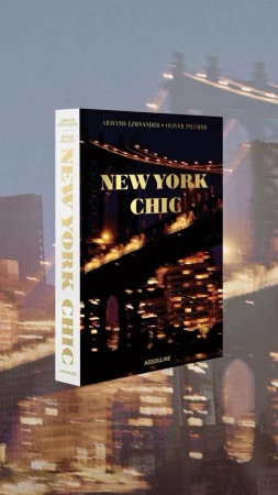 A book titled New York Chic by Oliver Pilcher set against a blurry nighttime background of a bridge in New York City.