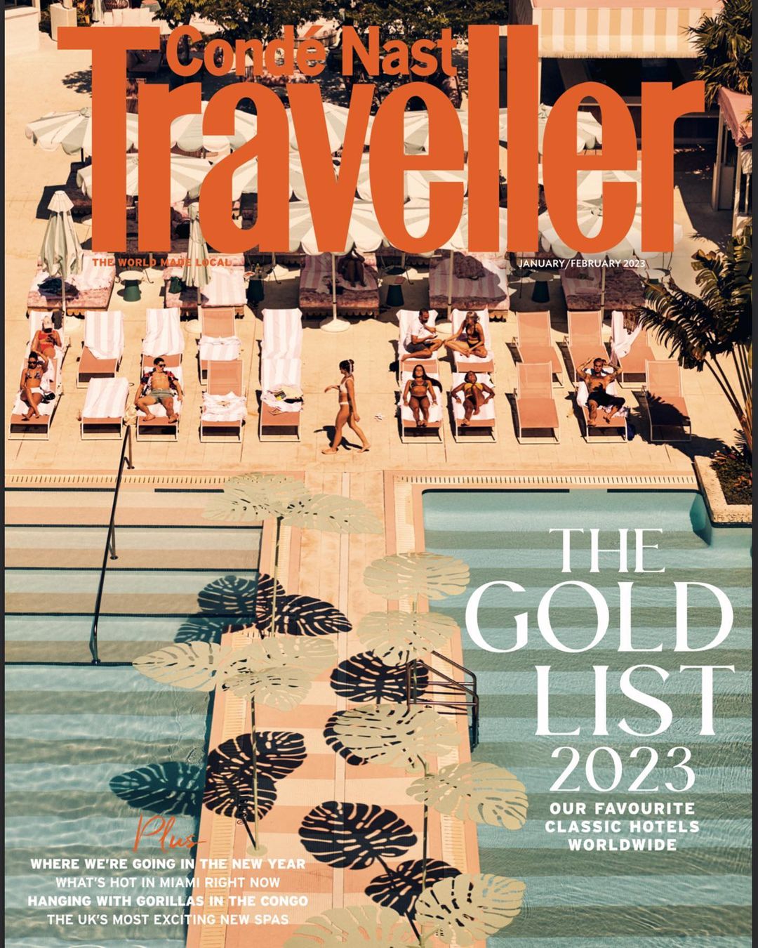 Condé Nast Traveller cover featuring people sunbathing by a pool at a hotel, palm tree shadows, and the magazine's title and cover lines.