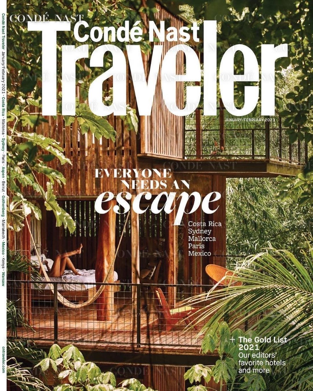 Condé Nast Traveler magazine cover featuring a woman relaxing in a hammock on the balcony of a wooden treehouse surrounded by foliage.