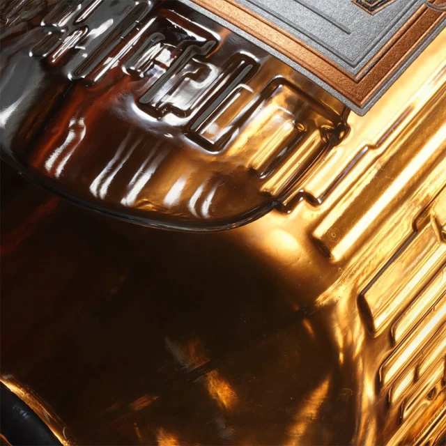Abstract close-up of a metallic surface with geometric patterns in bronze, silver, and copper tones creating a textured, modern design.