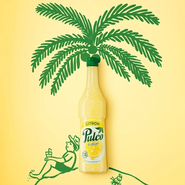 Bottle of Pulco Lemonade stands tall beneath a palm tree drawing on a sunny yellow background, alongside a relaxing cartoon figure.