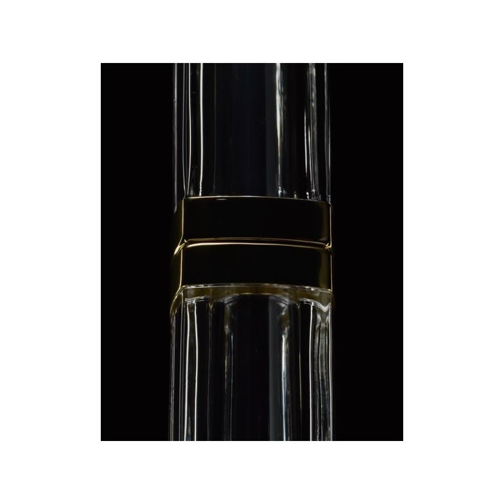 Elegant close-up of a tall, clear glass vase with gold accents, set against a solid black background. Clear glass details.