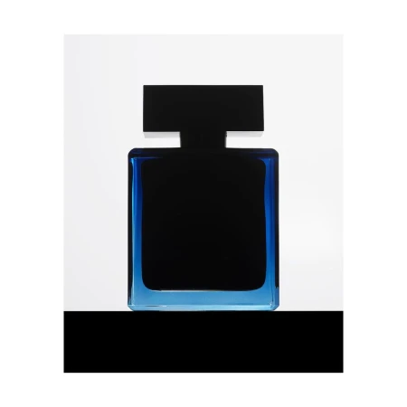 Elegant, squared perfume bottle featuring dark liquid enclosed by a transparent blue glass frame, set against a clean, white backdrop.