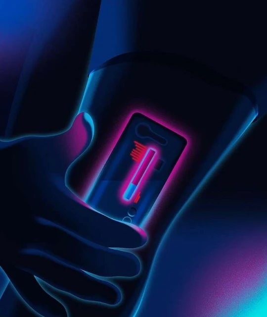 Person holding a digital device that displays an image of a pregnancy test in blue and pink neon lighting, highlighting the result.
