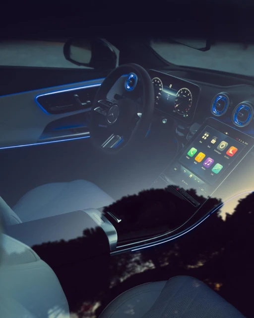 Car interior with sleek dashboard, digital display, and ambient lighting, blending modern design with technological features.