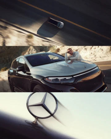 Car on a desert highway with a man posing on the hood and a close-up of the Mercedes-Benz hood ornament.