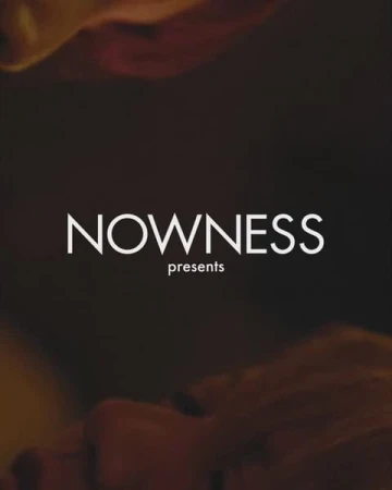 Abstract studio shot with 'Nowness' logo and muted colors, creating a visually engaging title graphic for media or entertainment.