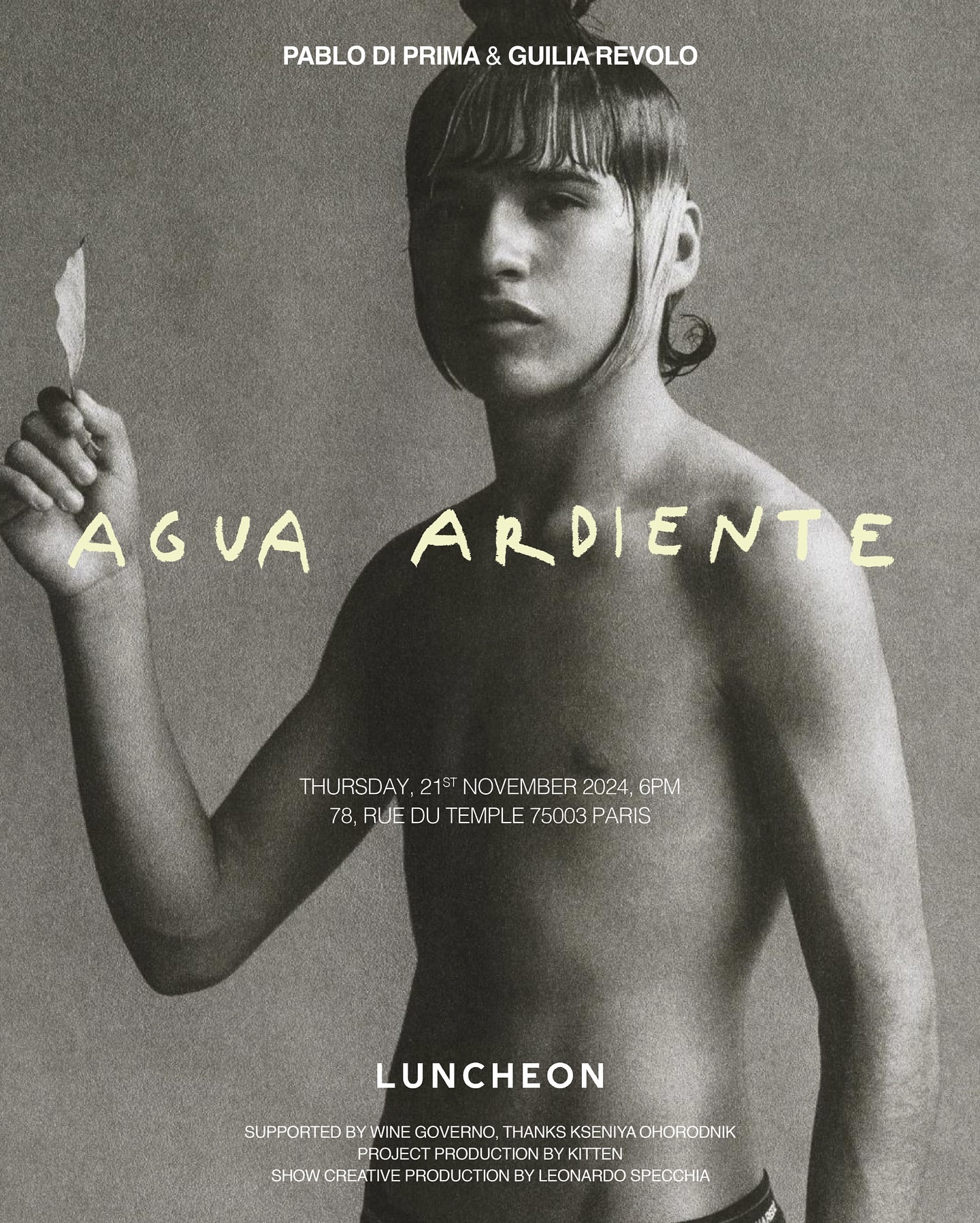 Monochromatic fashion poster features a bare-chested person holding a leaf, promoting 'Agua Ardiente'. Event details are included.