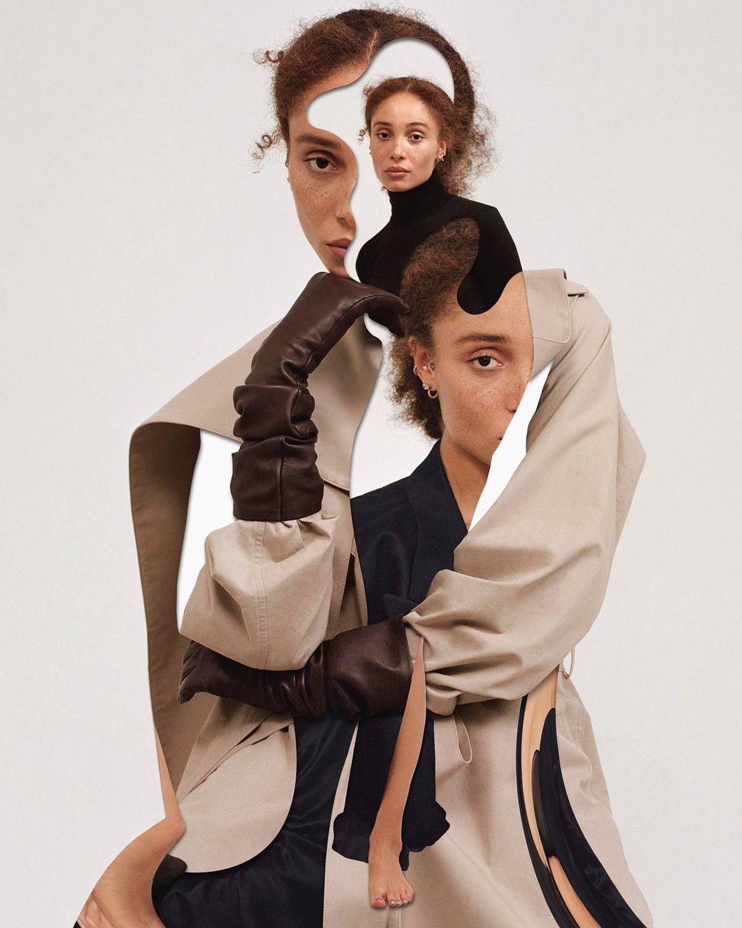 Artistic fashion portrait of a woman with collage-style effects, featuring a trench coat, black top, and expressive facial features in a light studio.