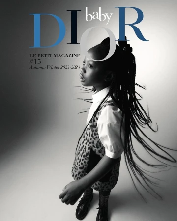Young girl in leopard-print dress on Dior Baby magazine cover, in studio with blue and black text, Autumn-Winter 2023-2024 issue.