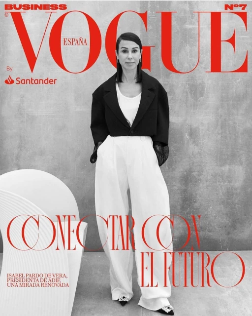 Vogue España business cover featuring Isabel Pardo de Vera in black jacket and white pants, standing against gray background.