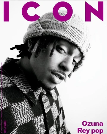Black and white portrait of Ozuna on the cover of ICON magazine, wearing a patterned beanie and a collared shirt with a bold checkered pattern.