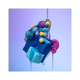 Surreal sculptural still life by Paloma Rincon featuring a blue box covered in colorful felt balls with purple liquid pouring over it