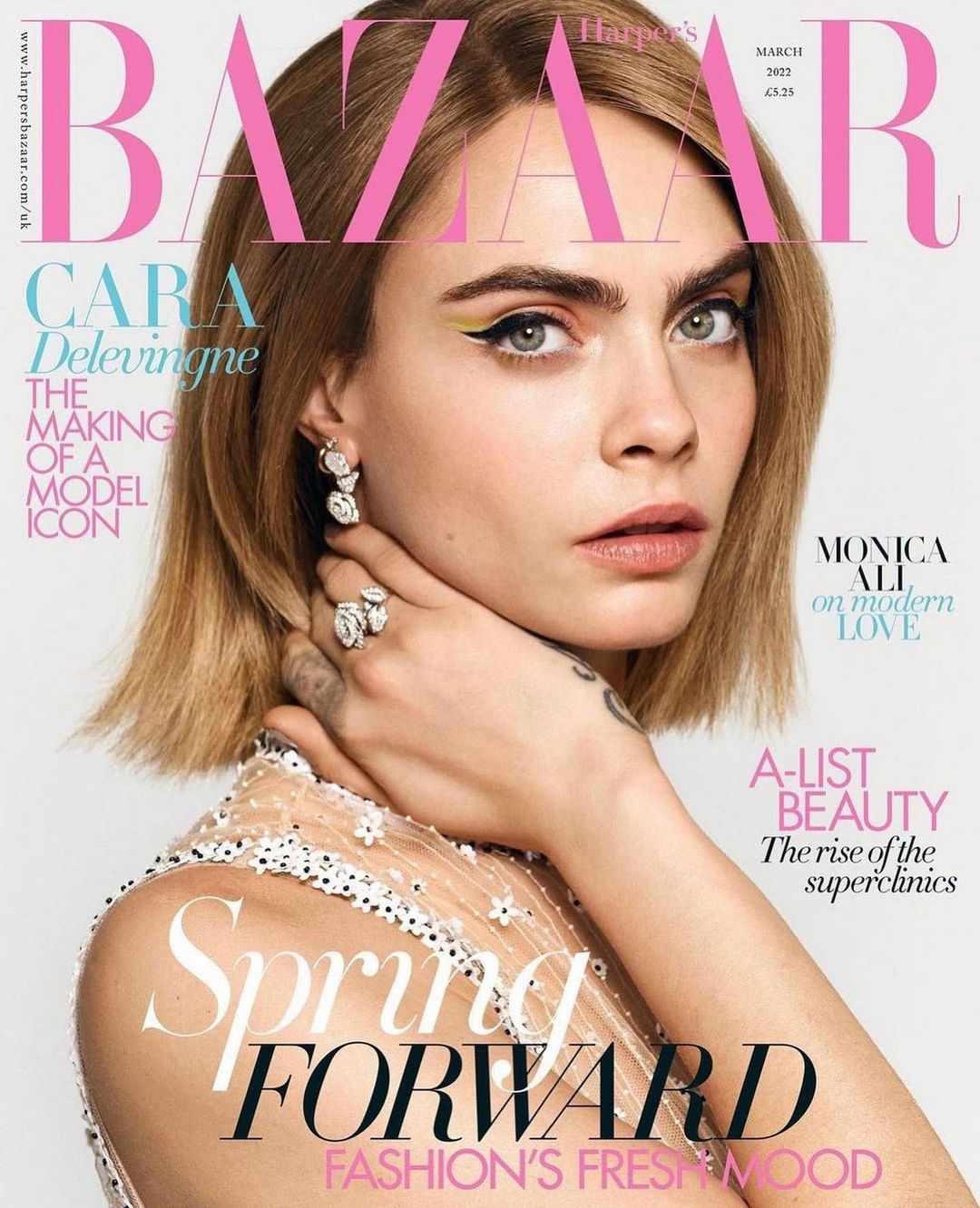 Cara Delevingne on Harper's Bazaar cover, March 2022. Close-up shot of the model with blond hair, elegant makeup, and jewelry.