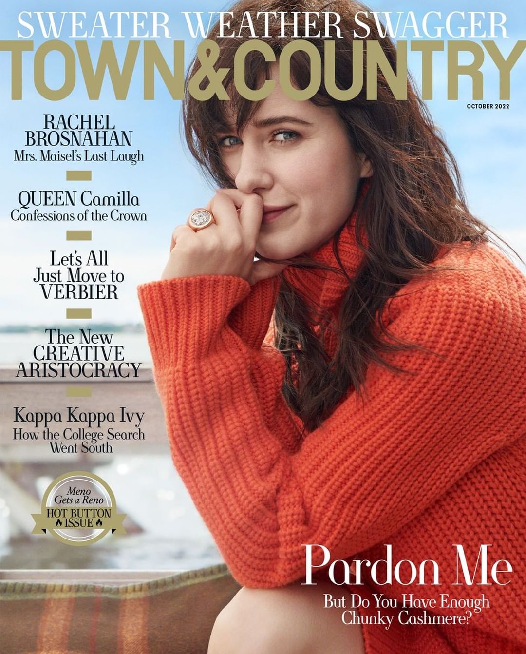 Magazine cover featuring a woman with brown hair wearing an orange sweater, with text overlay and a glimpse of a water and sky background.