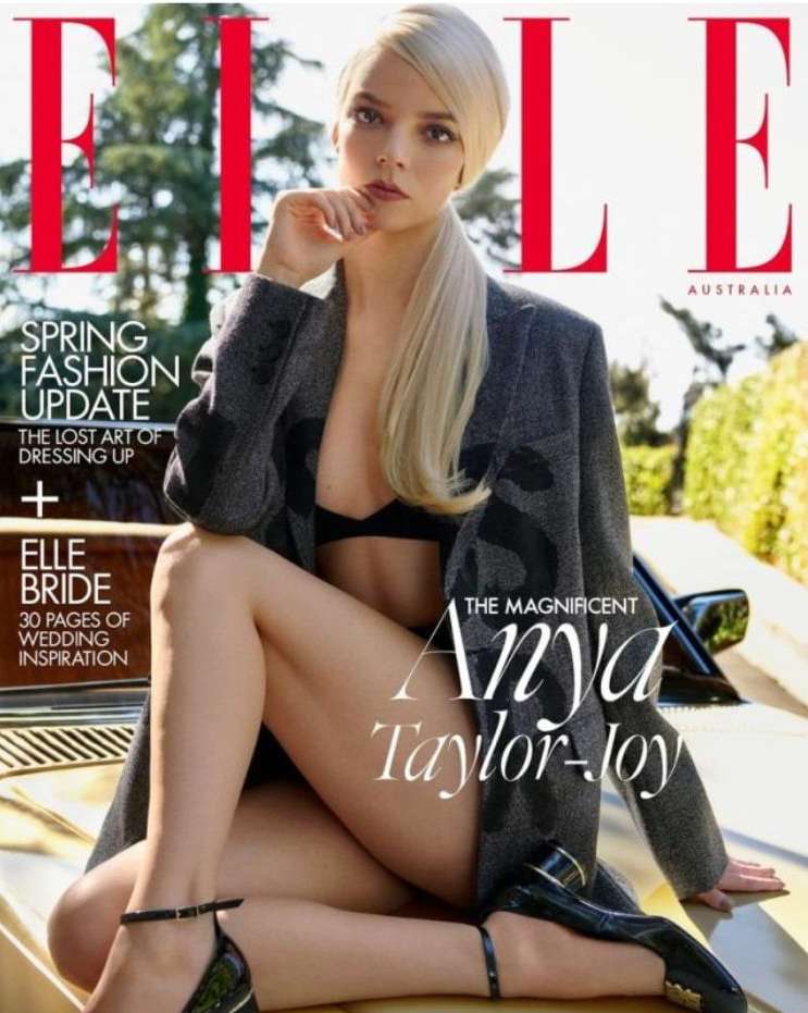 Elle Australia magazine cover featuring Anya Taylor-Joy sitting on a vehicle in a blazer, bra, and strappy heels, posing outdoors.