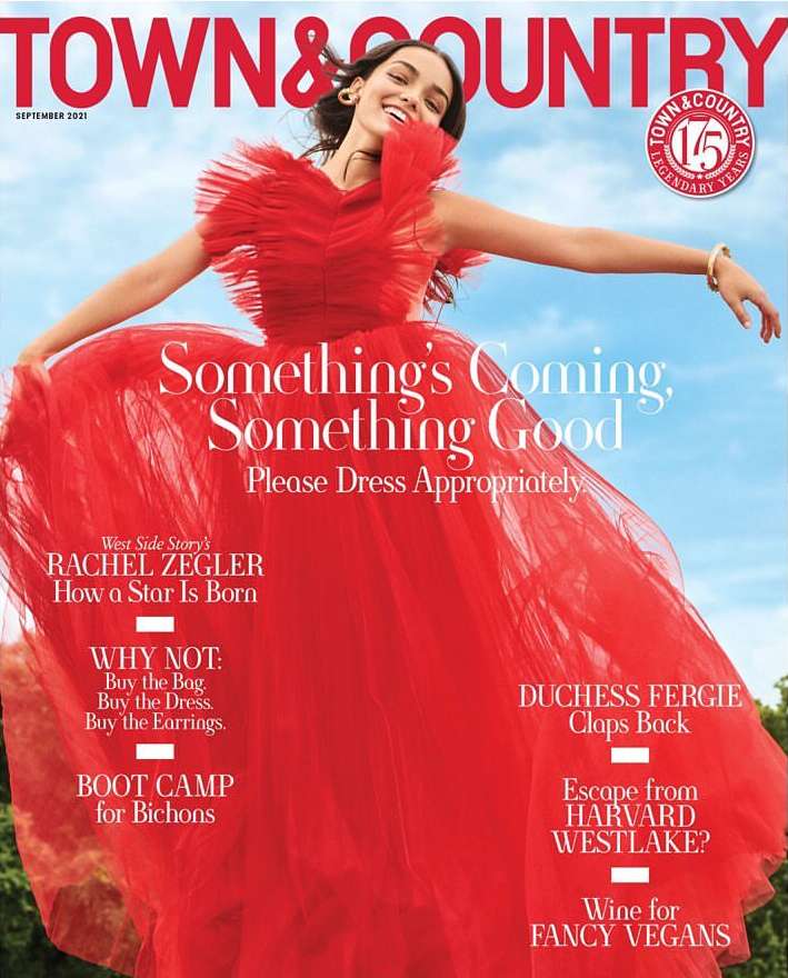 Magazine cover featuring a woman in a red tulle dress with the 'Town & Country' logo and various article titles.