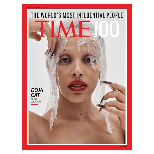 Time magazine cover featuring Doja Cat with clear plastic draping, red lipstick, and long nails, in a portrait framed by a red border.