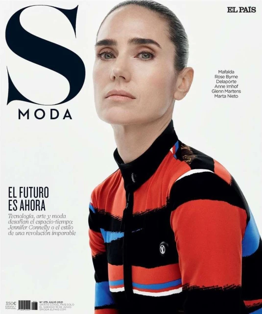 Jennifer Connelly on cover of El País S Moda magazine wearing colorful striped collared long-sleeve shirt against a white backdrop.