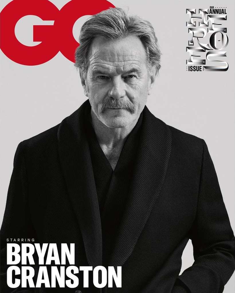 Black and white portrait of Bryan Cranston on the cover of GQ Magazine, featuring close-up of the actor in a robe. 