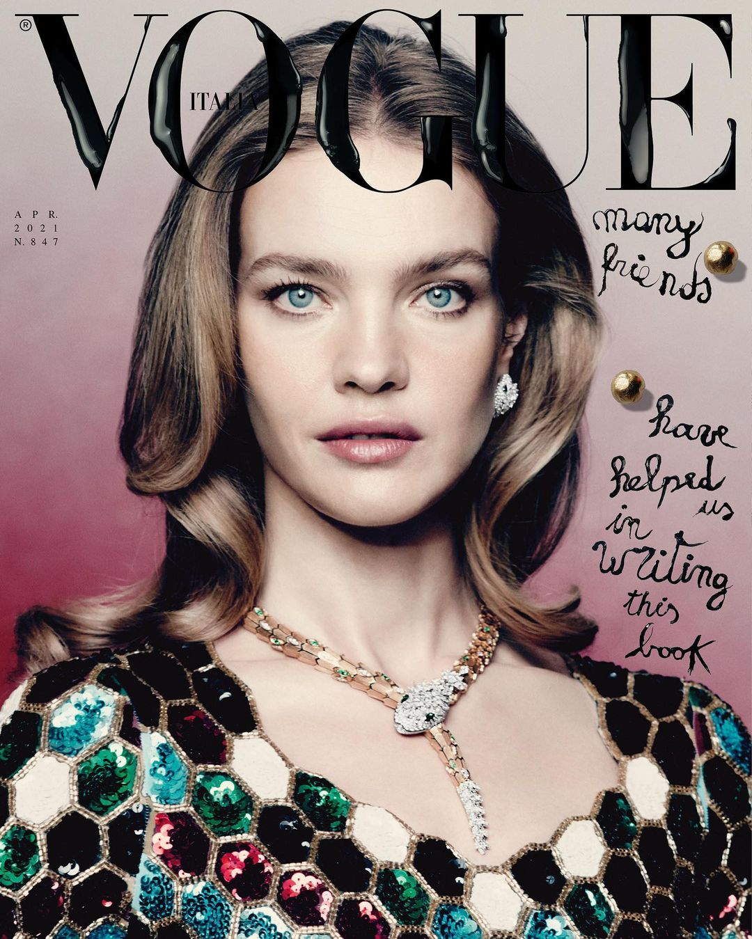 Vogue Italia cover featuring a blonde woman with blue eyes wearing a colorful sequined dress and Bulgari jewelry against a pink backdrop.