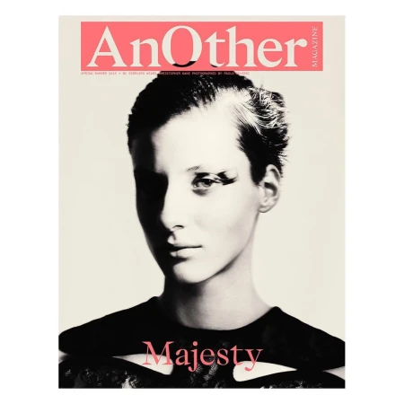 Portrait of a woman wearing a dark patterned top against a plain background with magazine masthead typography