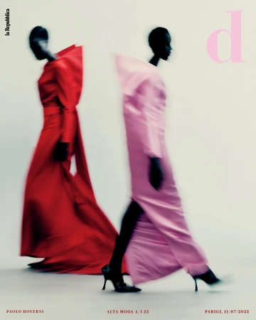 Two fashion models in gowns walking, blurred motion effect, monochromatic colors, light background, studio lighting. Editorial fashion photography.