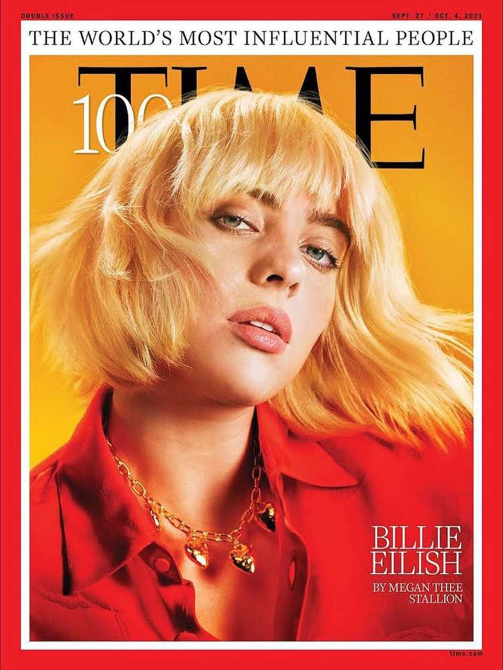 Billie Eilish portrait on the cover of Time magazine. She is wearing a red blouse and a gold necklace with heart pendants.