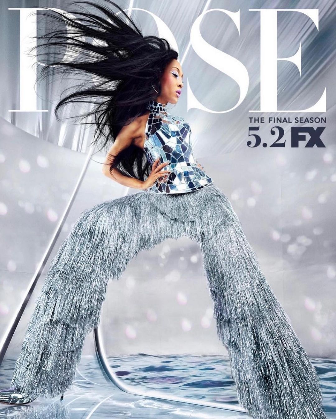 Portrait of an African-American woman with long dark hair posing in a mosaic top and silver fringed pants, advertising Pose: The Final Season on FX.