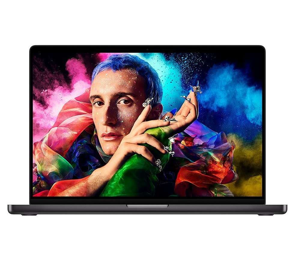 Laptop displays a person with blue hair, face glitter, and long ornamented nails against a colorful smoky background.
