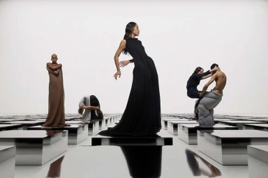 Group of models posing among reflective silver pedestals against a bright white background, photographed by Pascal Schonlau.