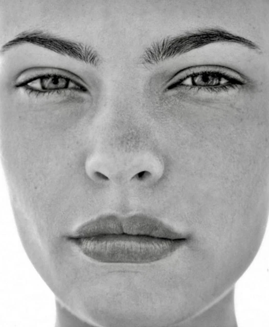 Monochrome portrait of a woman's face featuring symmetrical composition and soft, diffused lighting emphasizing her natural skin texture.