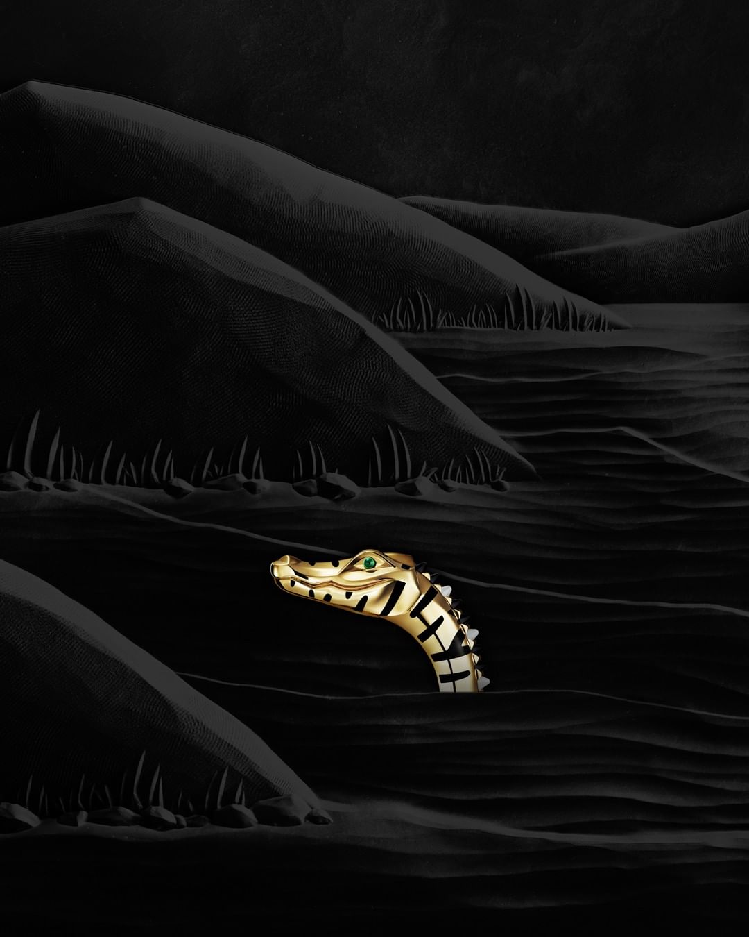 A surreal, dark, fantasy art image of a gold alligator head emerging from dark, sandy ripples against a black, hilly landscape.