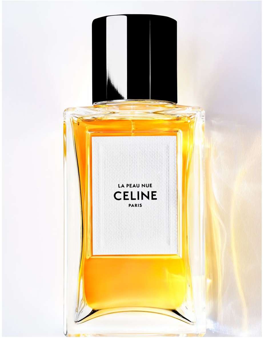 Celine perfume bottle filled with golden fragrance against a minimal white background